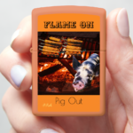 This is a Orange, uniquely designed zippo lighter with a pig and vegetarian barbeque that says Flame On.  It links to more uniquely designed lighters.